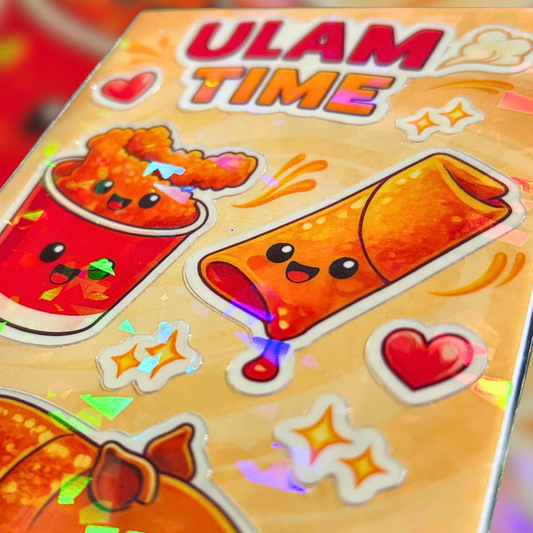 Close up image of sticker sheet with cartoon food characters and 'ULAM TIME' text on a colorful background