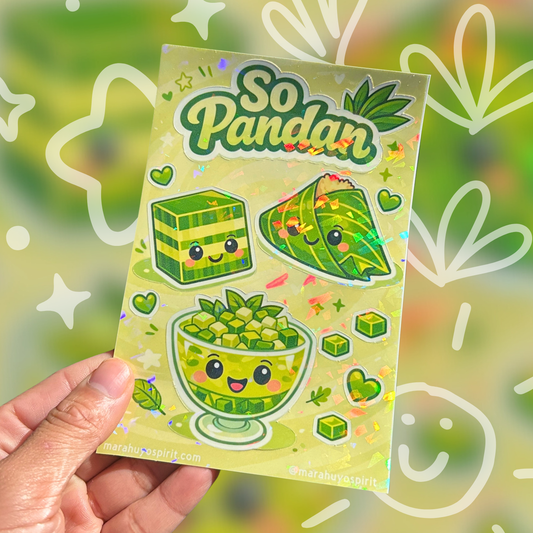 Sticker sheet with cartoon pandan-themed designs held by a hand against a decorative background.