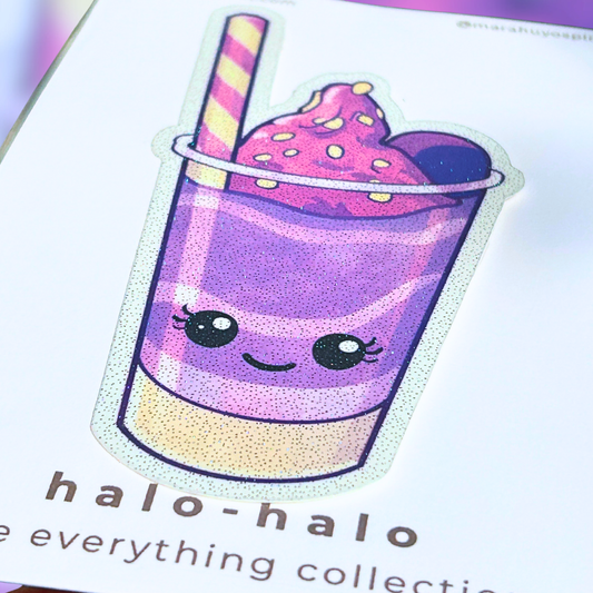Close up photo of of a die-cut decal of a purple and pink 'halo-halo' dessert with a straw on a colorful background.
