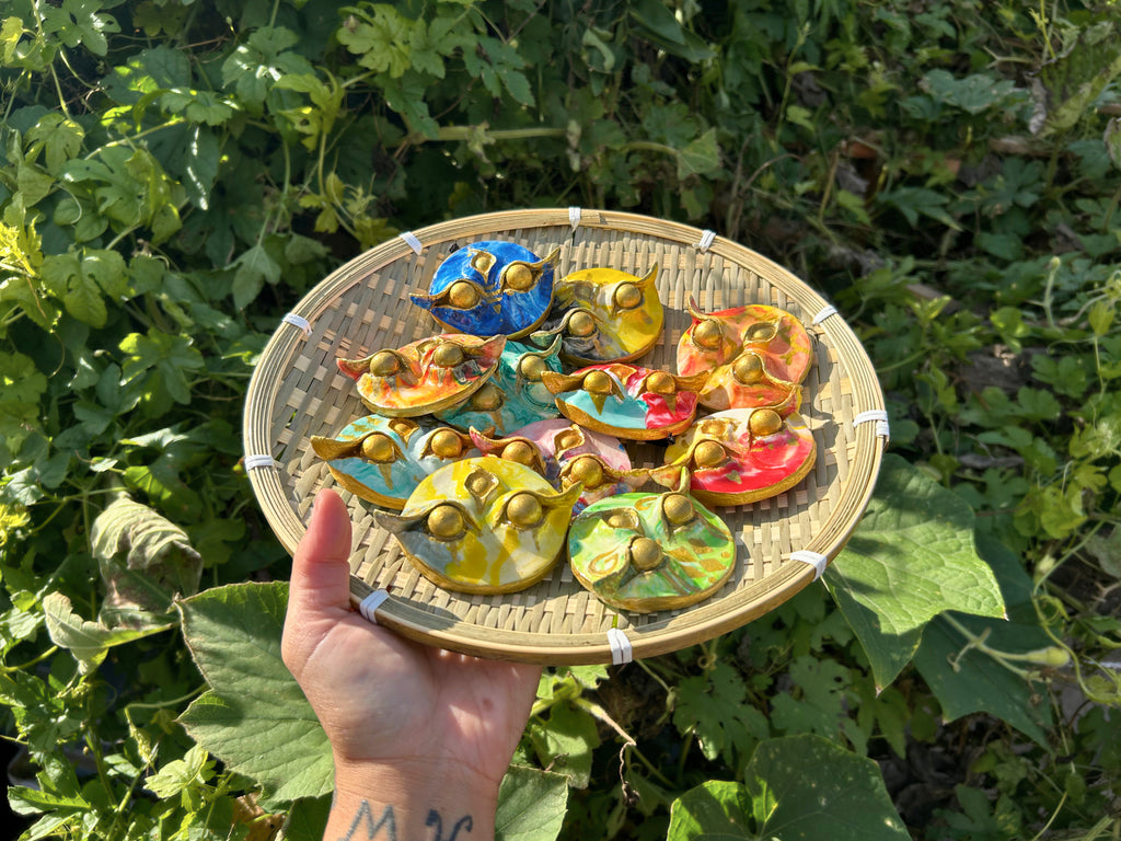 Batok Spirit handmade Filipino guardian charm with gold batok tattoo symbols on unique background