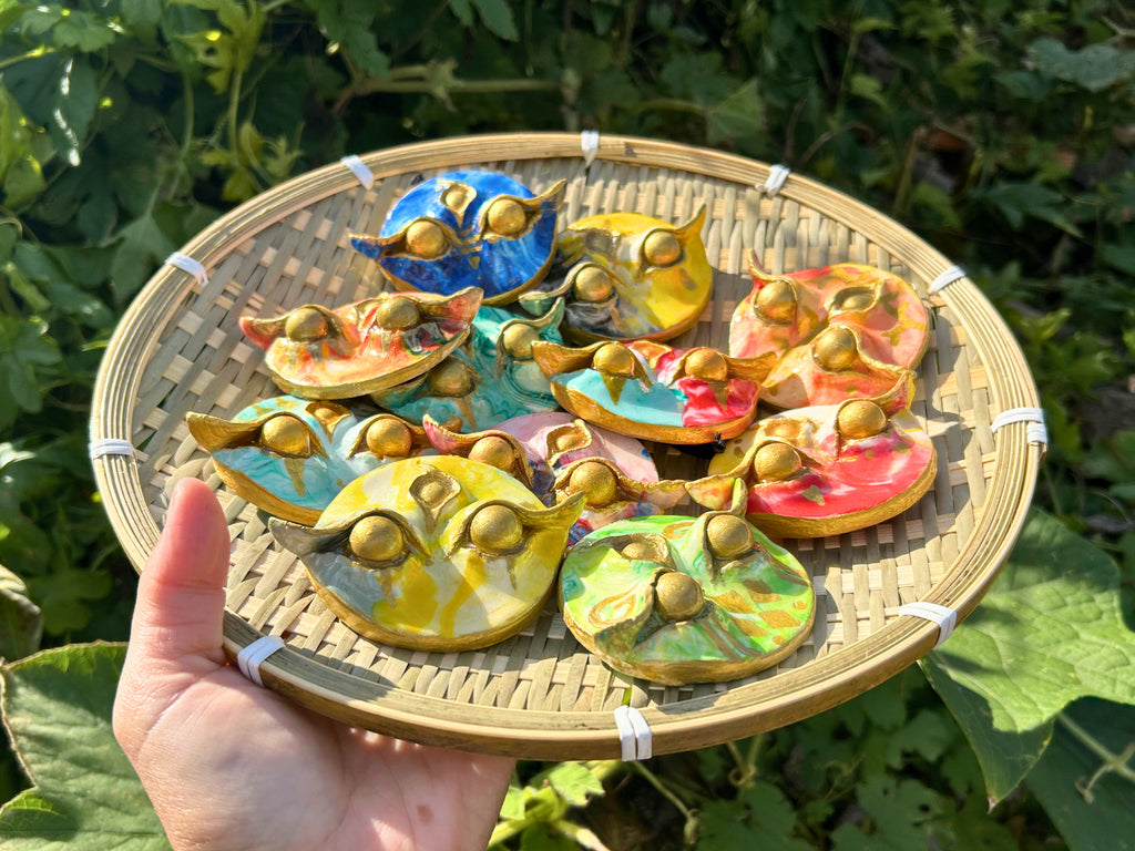 Batok Spirit handmade Filipino guardian charm with gold batok tattoo symbols on unique background